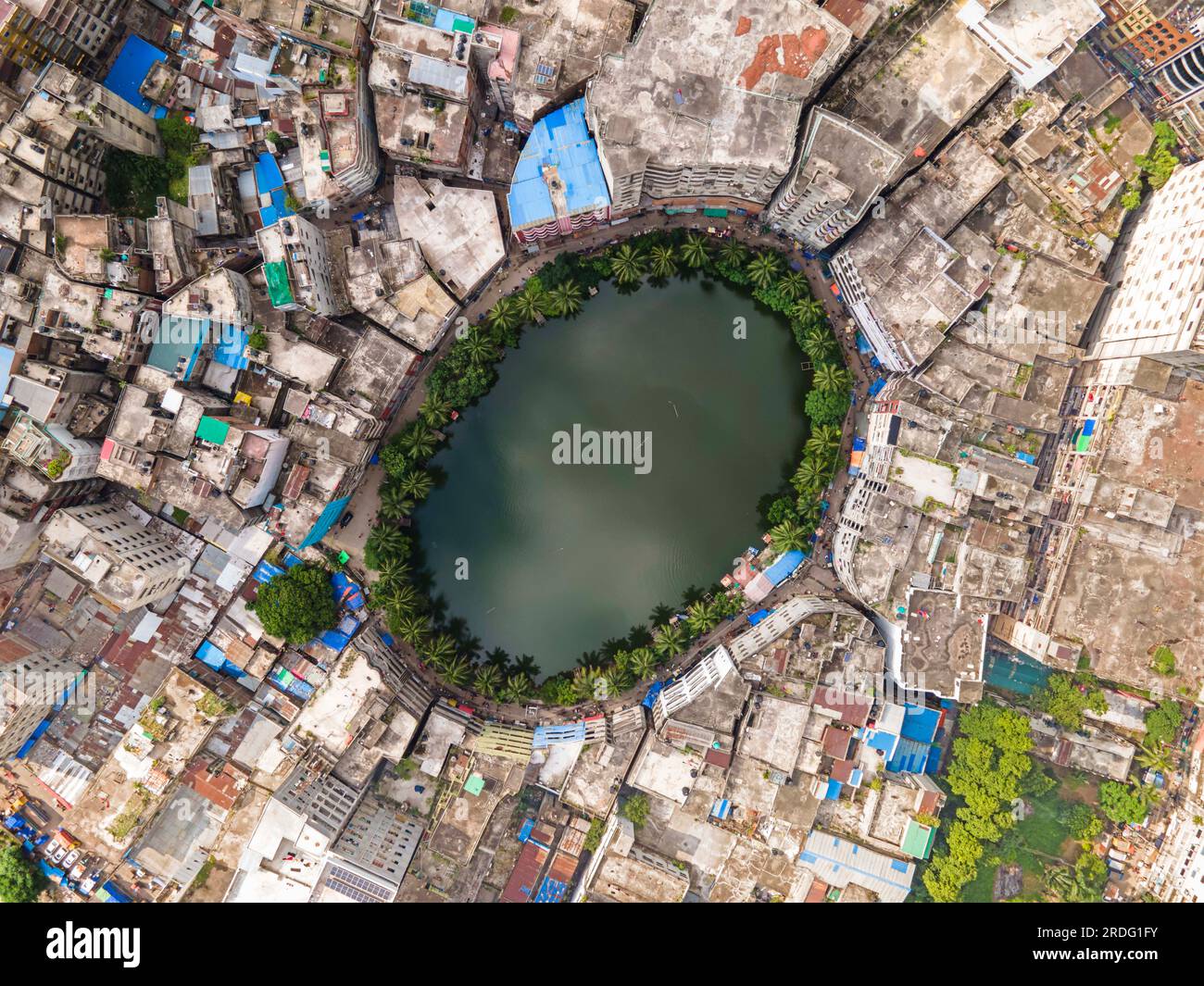 Dhaka, Dhaka, Bangladesh. 20th July, 2023. Gol Talab, also known as Nawab Bari Pukur, is a small oval-shaped pond in Old Dhaka. Once the capital city had 300 ponds but the number has now shrunk to only 30. Gol Talab, a heritage site, is one of these last ponds that have a significant impact on the environment and biodiversity of the urban climate. The photograph was taken on 20 july 2023. (Credit Image: © Muhammad Amdad Hossain/ZUMA Press Wire) EDITORIAL USAGE ONLY! Not for Commercial USAGE! Stock Photo