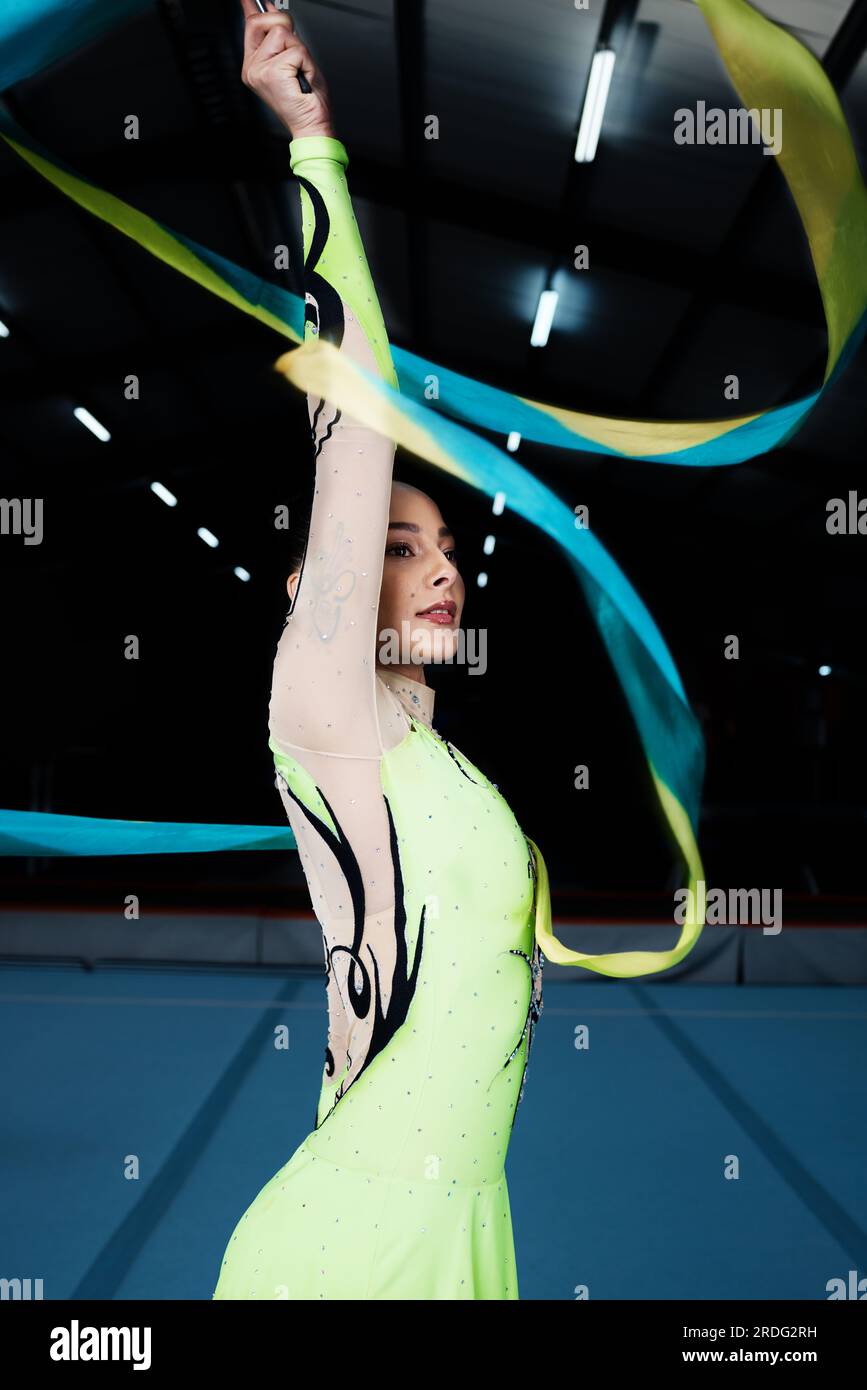 Ribbon, dance and rhythmic gymnastics, woman in gym with action and