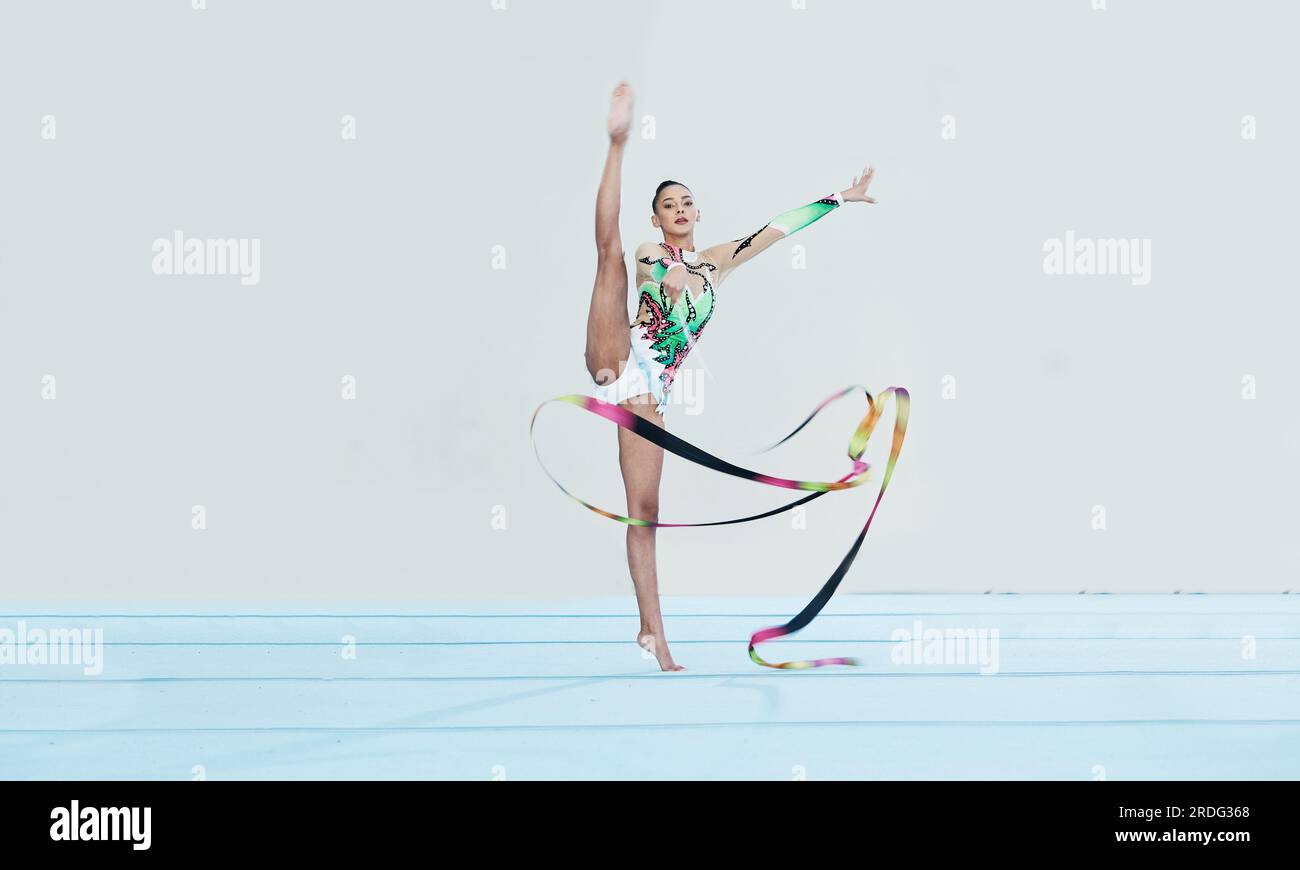Gymnastics Rope Split Gymnastics training, woman and ribbon with legs split for competition ...