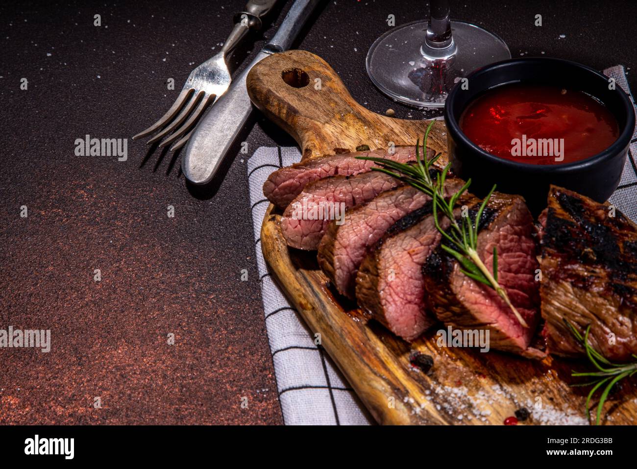Grilled meat steak on dark table, Pork, veal, lamb, beef steak medium, medium well on cutting