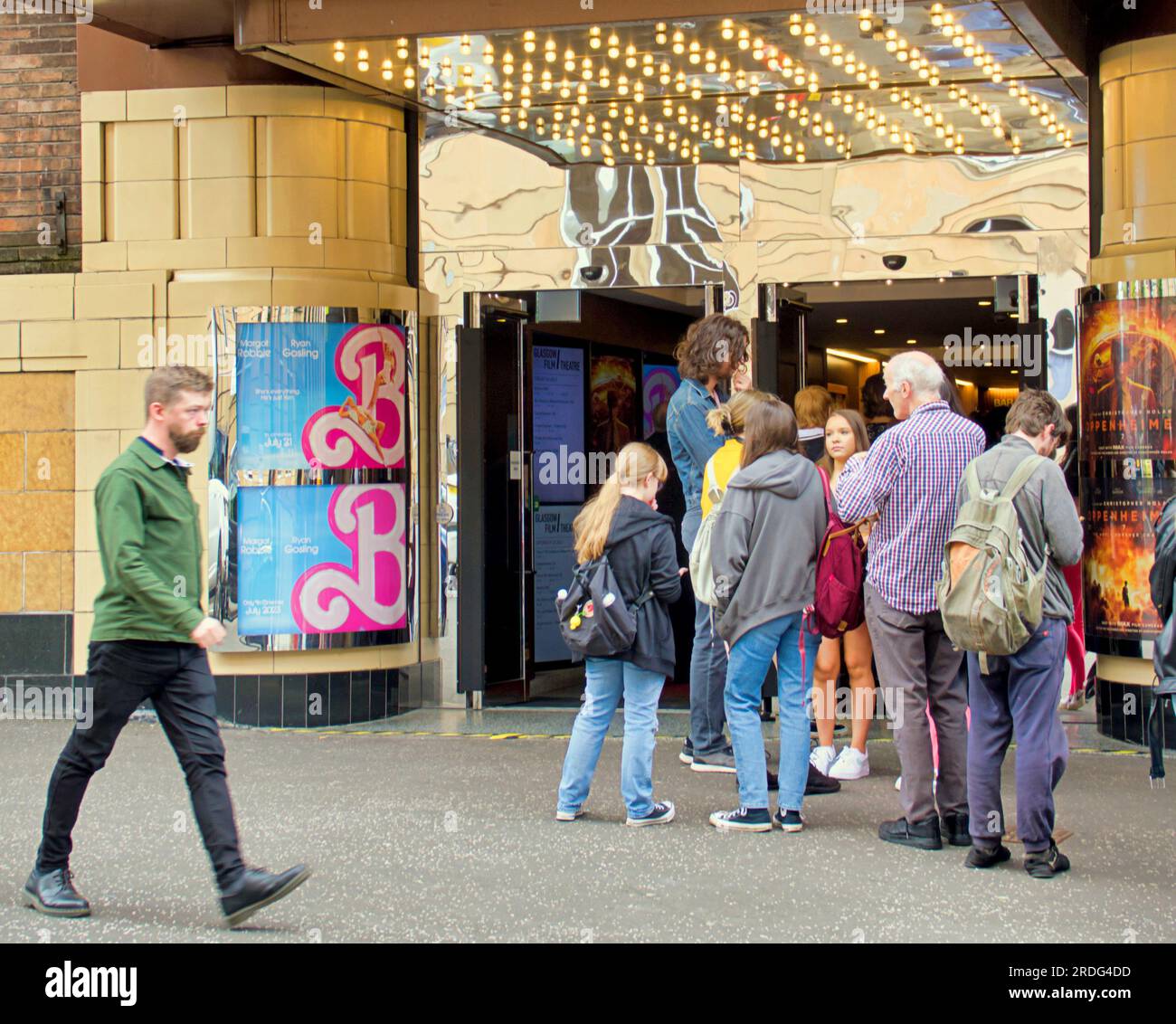 Glasgow, Scotland, UK 21st July, 2023. Barbie and oppenheimer dual release saw  Glasgow film theatre sees queues around block for barbie as fans crossed sauchiehall street from the cinema in rose street as fever hit the city with many getting pinked for the occasion. Credit Gerard Ferry/Alamy Live News Stock Photo