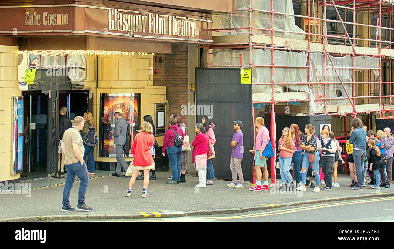 Glasgow, Scotland, UK 21st July, 2023. Barbie and oppenheimer dual release saw  Glasgow film theatre sees queues around block for barbie as fans crossed sauchiehall street from the cinema in rose street as fever hit the city with many getting pinked for the occasion. Credit Gerard Ferry/Alamy Live News Stock Photo
