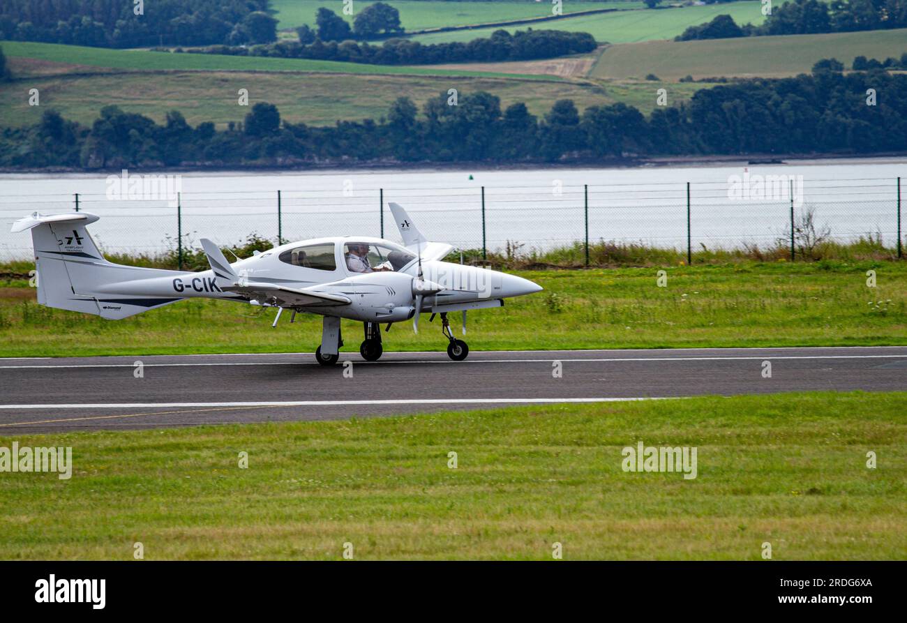 Dundee, Tayside, Scotland, UK. 21st July, 2023. The weather across Tayside, Scotland is warm and bright with temperatures reaching 22°C. G-CIKM ACSFLIGHT Multi Engine Piston Class Rating - DA42 Twinstar Training aircraft landing and taking off exercise at the Dundee Riverside airport, Scotland. Credit: Dundee Photographics/Alamy Live News Stock Photo