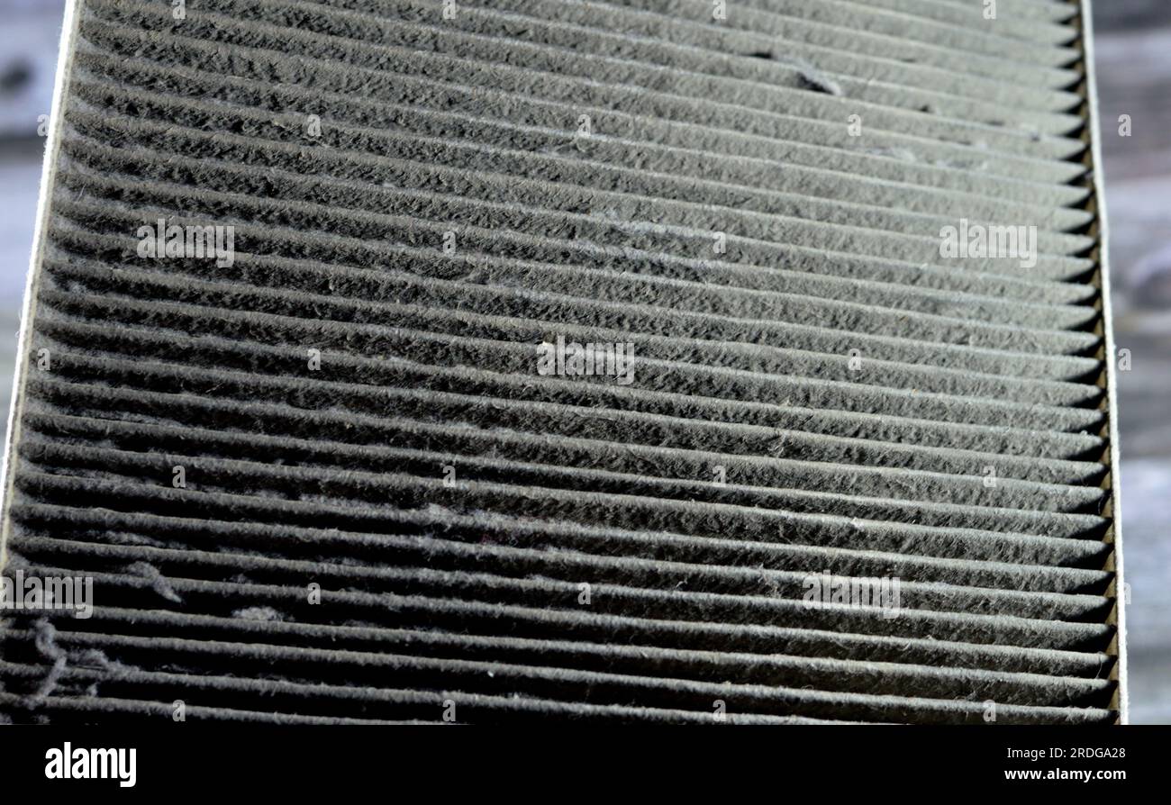 old dirty used car AC air conditioning filter full of dust removed from