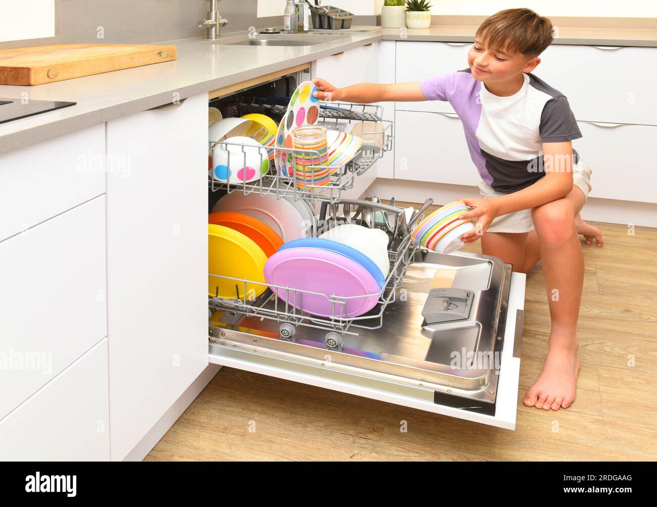 boy with dishwasher Stock Photo