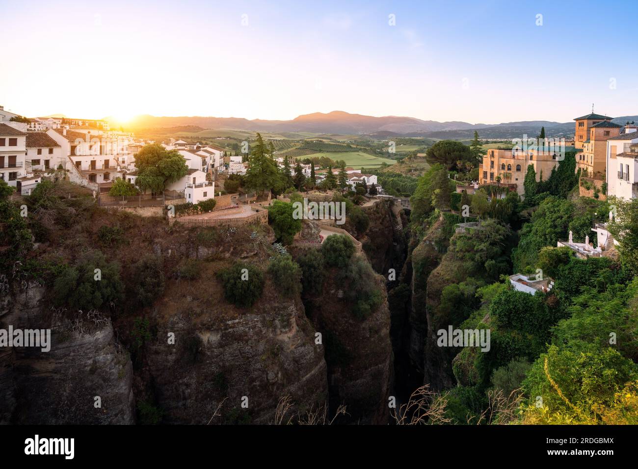 El Tajo Canyon at sunrise with Cuenca Gardens, Casa del Rey Moro and Puente Viejo Bridge - Ronda, Andalusia, Spain Stock Photo