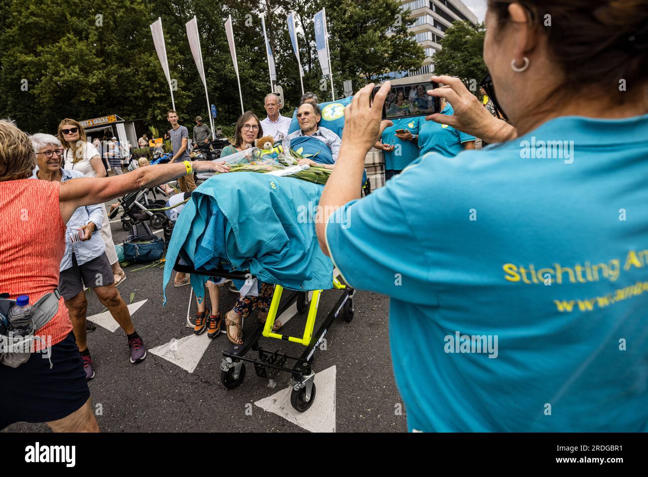 NIJMEGEN - 21072023, Mr. Art is waiting for its XXX together with  volunteers from the Ambulance Wens Foundation. Walkers walk on the Via  Gladiola during the last day of the Nijmegen Four