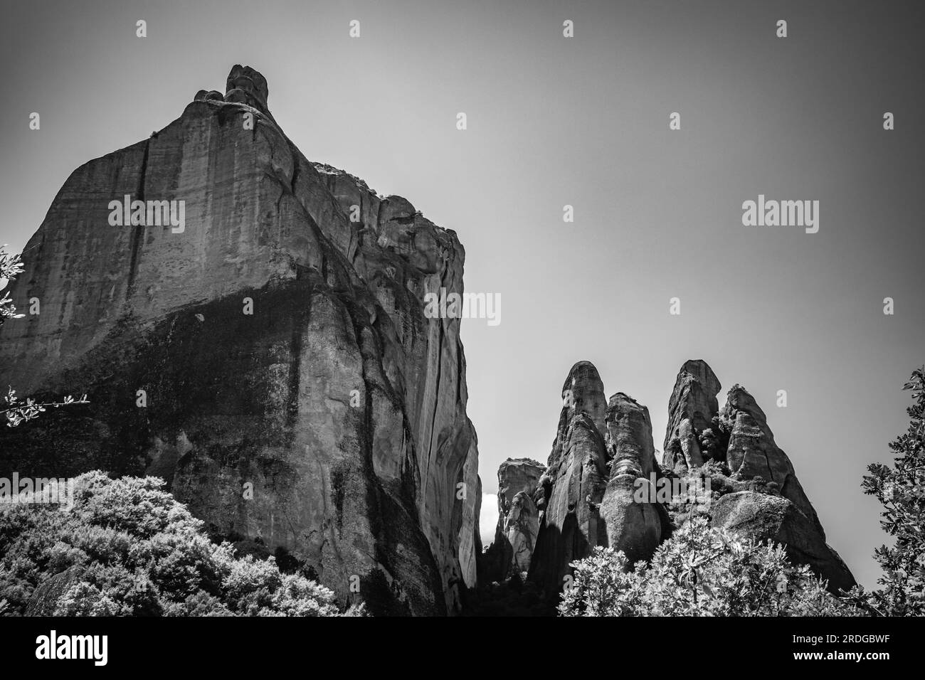 Traveling around Meteora, Greece and its divine complex of monasteries, famous pilgrimage Greek destination. Black and white Stock Photo