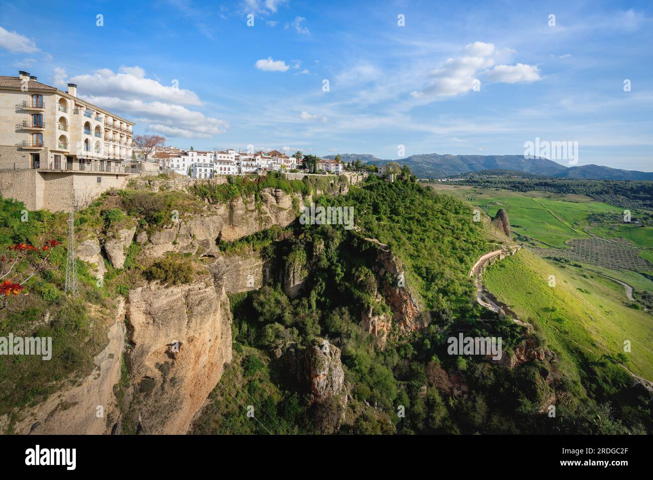 View of Ronda Buildings over the Cliff with Walls and Valley - Ronda, Andalusia, Spain Stock Photo