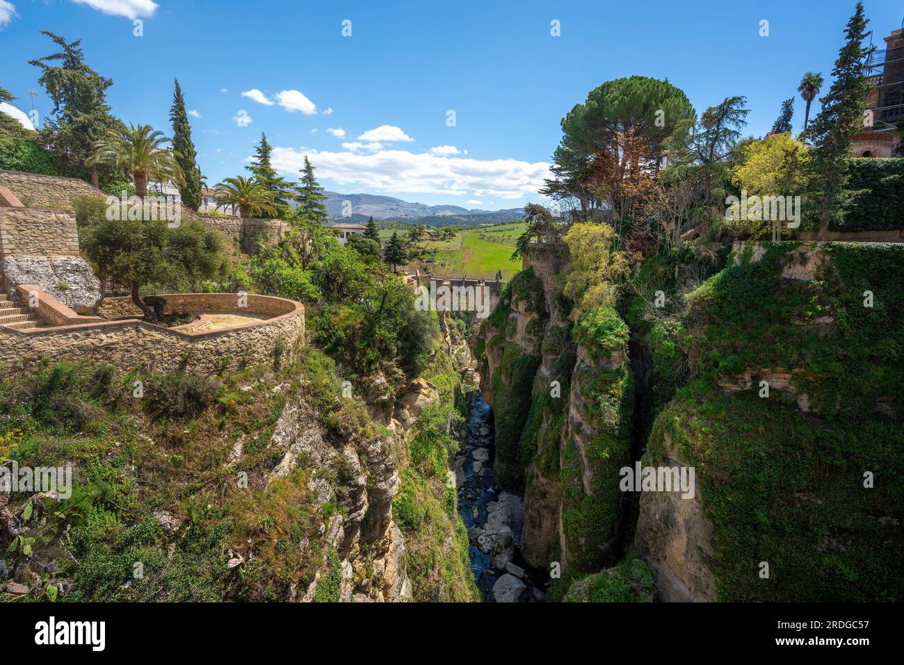Cuenca Gardens and Puente Viejo Bridge at El Tajo Canyon - Ronda, Andalusia, Spain Stock Photo