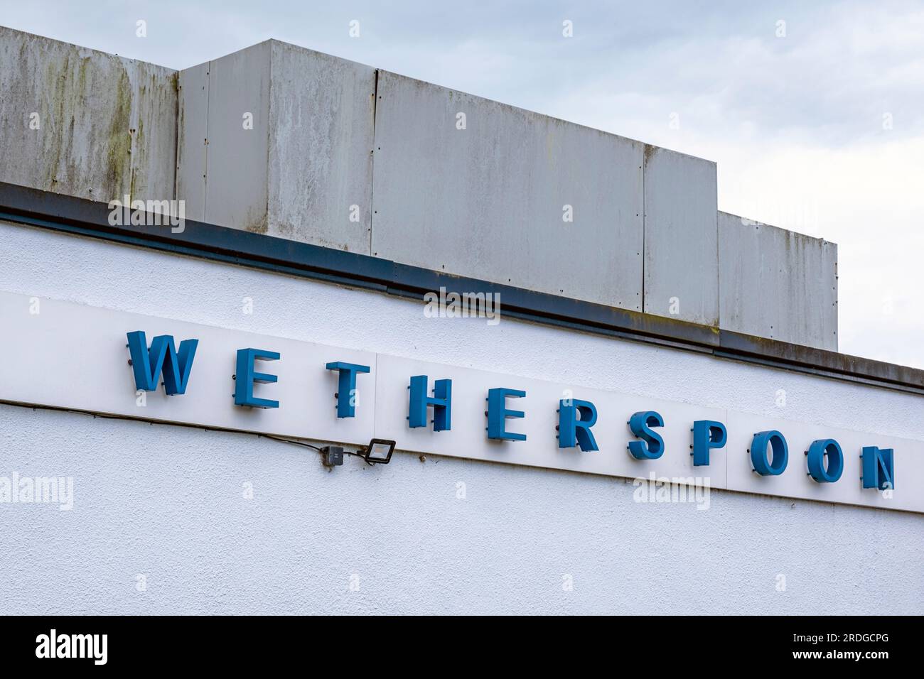 Wetherspoon pub sign or logo on outside wall UK Stock Photo