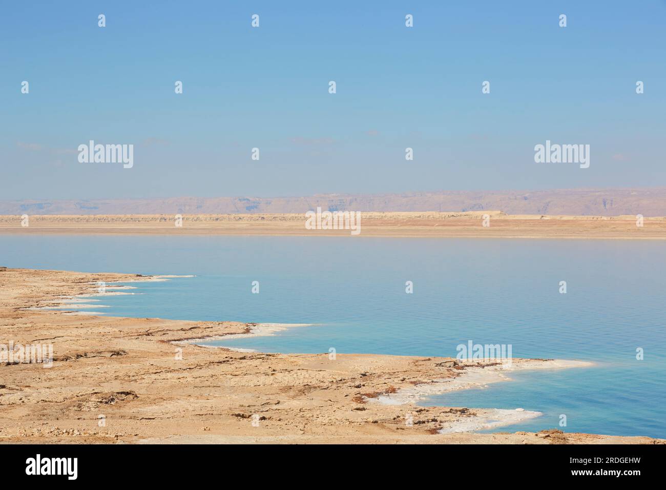 Barren landscape around The Dead Sea, the West Bank in the distance, Jordan Stock Photo