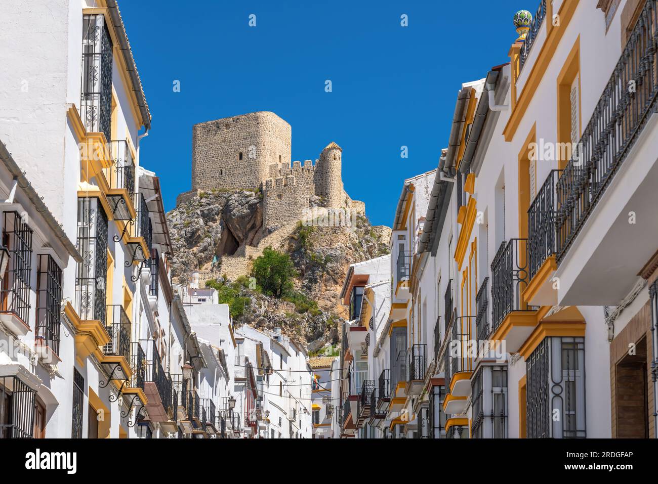 Street with Olvera Castle - Olvera, Andalusia, Spain Stock Photo