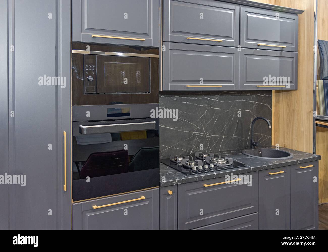 Black Microwave and Conventional Oven Built in Modern Kitchen Black