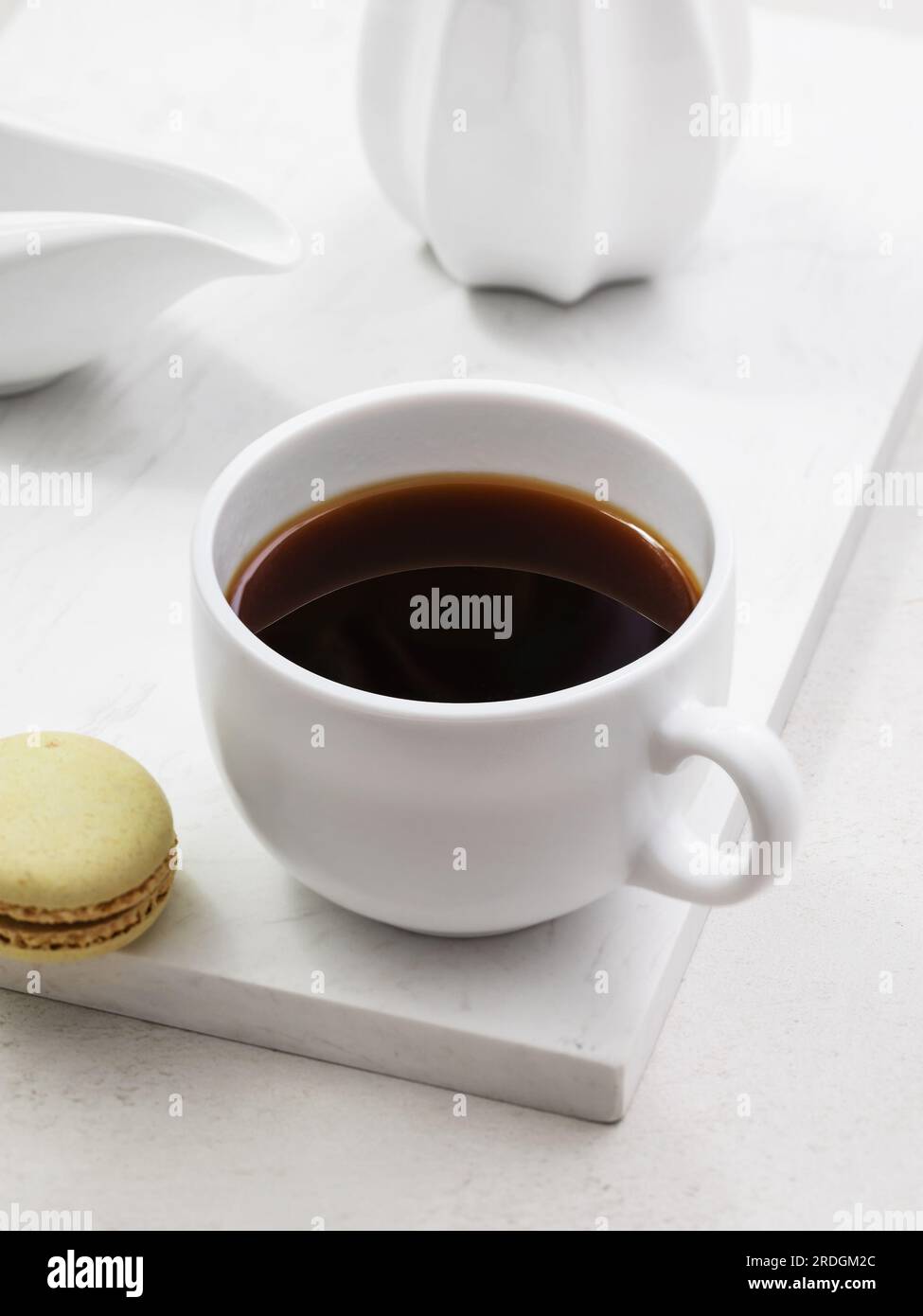Cup of coffee with macaroons on the table Stock Photo
