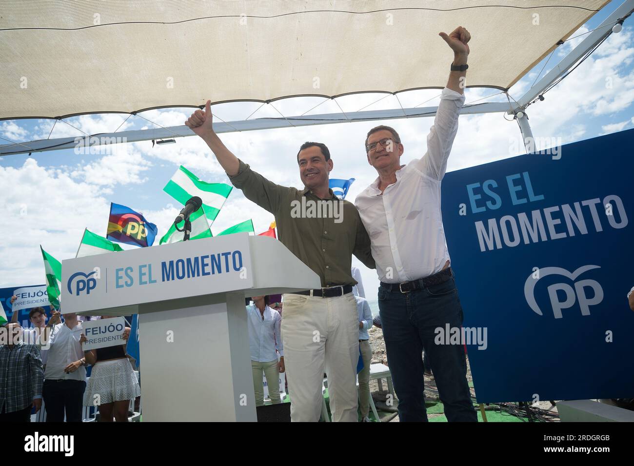 Malaga, Spain. 21st July, 2023. Spanish Popular Party opposition leader Alberto Nunez Feijoo (R) is seen waving to supporters next to Andalusian Regional government Juan Manuel Moreno (L) during a closing campaign rally ahead of July 23 general election. The electoral polls give victory to the Popular Party but it would need the support of the far-right party VOX to be able to govern. Credit: SOPA Images Limited/Alamy Live News Stock Photo