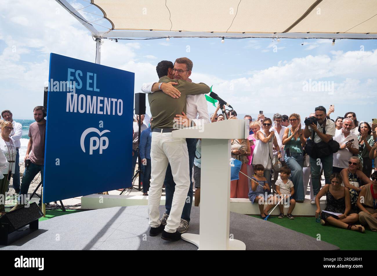 Malaga, Spain. 21st July, 2023. Spanish Popular Party opposition leader Alberto Nunez Feijoo (1-R) is seen embracing Andalusian Regional government Juan Manuel Moreno (2-L) during a closing campaign rally ahead of July 23 general election. The electoral polls give victory to the Popular Party but it would need the support of the far-right party VOX to be able to govern. Credit: SOPA Images Limited/Alamy Live News Stock Photo