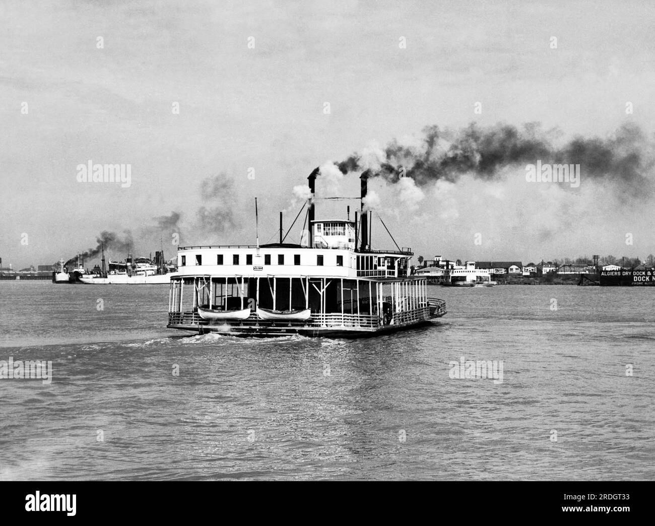 New Orleans, Louisiana:  c. 1931 The car ferry boat 'Algiers' crossing the Mississippi River. Stock Photo