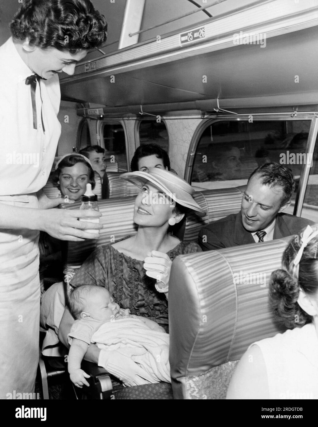Washington,  D.C.:  c. 1954 Trailways Bus Line new 'Five Star Luxury Service' run between Washington and Norfolk features hostesses, free luncheon snacks, magazines, and hi-fi music. Stock Photo