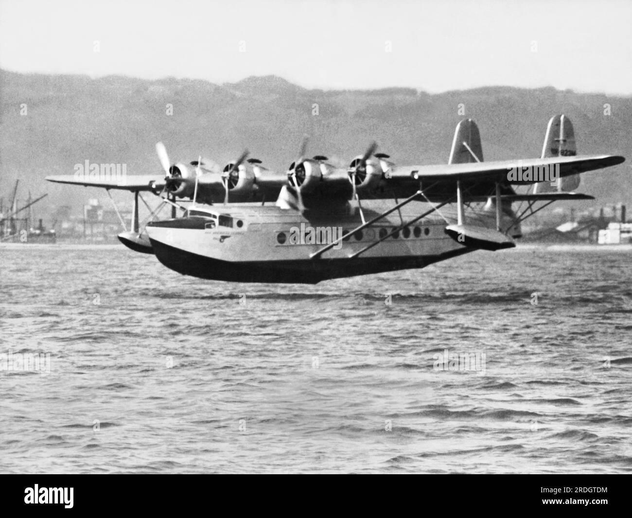 Oakland, California: April 23, 1935 The Pan American Clipper flying boat as it landed in San Francisco Bay becoming the first aircraft to complete a round trip flight between Hawaii and California. The return flight from Honolulu to Alameda took 21 hours. Stock Photo