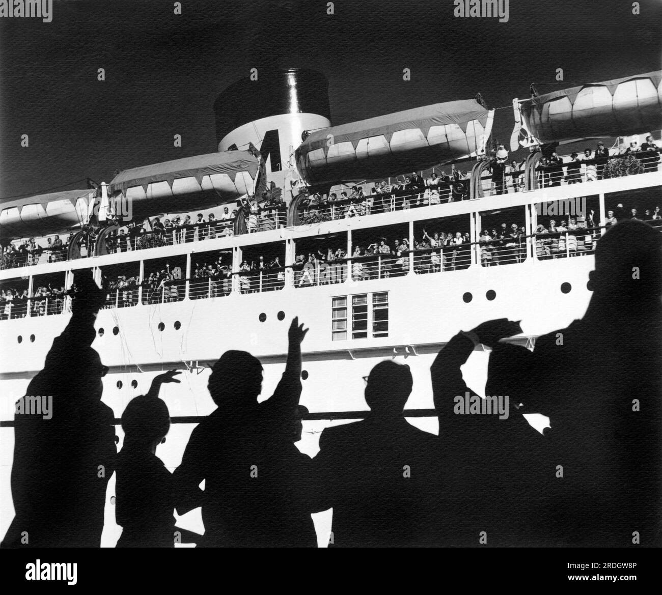 San Francisco, California:  c. 1955. People on the docks wave 'bon voyage' to friends and family departing on a Matson Liner. Stock Photo