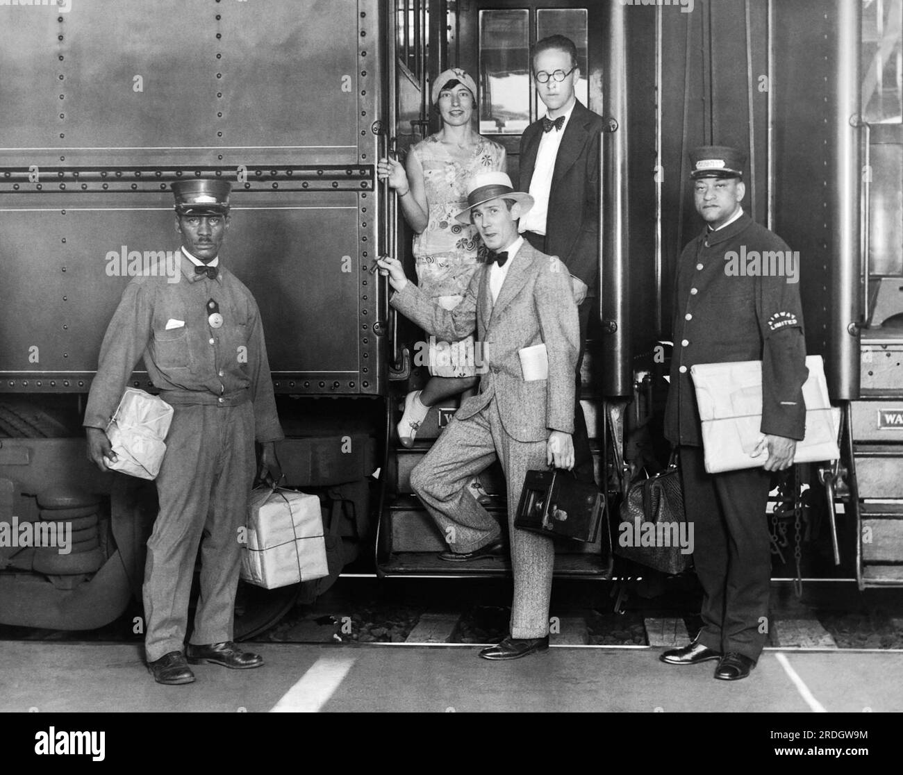 Washington, D.C.:  July 29, 1929 Leo Hessler, Underwood & Underwood photographer, boards the Airway Limited train for Columbus where he will board Transcontinental Air Transport's great trimotored planes to photograph the big businessmen and beautiful society women who are taking advantage of that time saving travel. Stock Photo