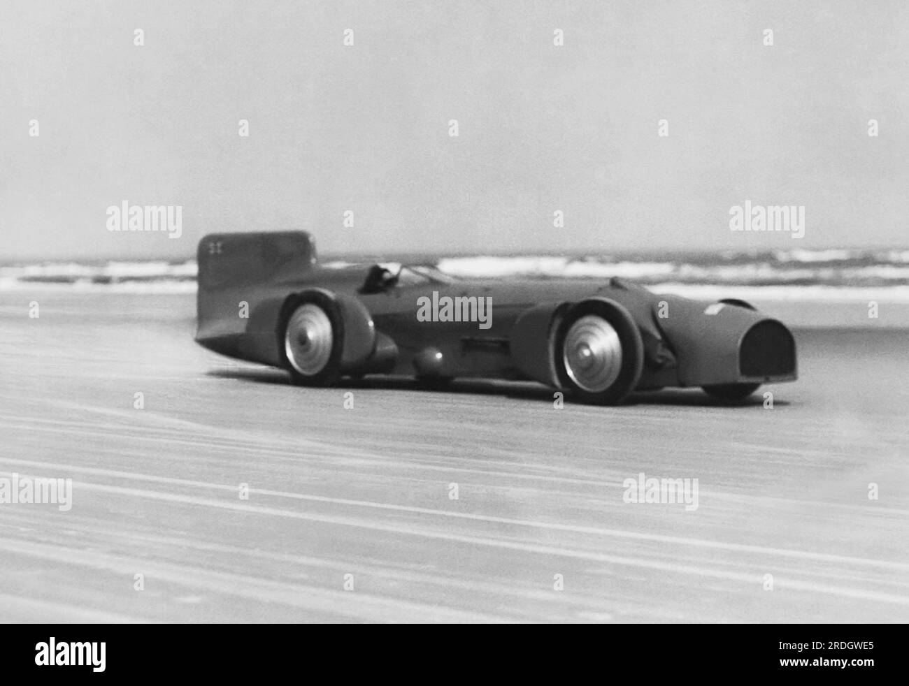 Daytona Beach, Florida:  February, 1931 British racer Captain Malcolm Campbell in his Bluebird race car setting a new auto speed record of 245 mph to shatter the old one of 231 mph by Major Seagrave. Stock Photo