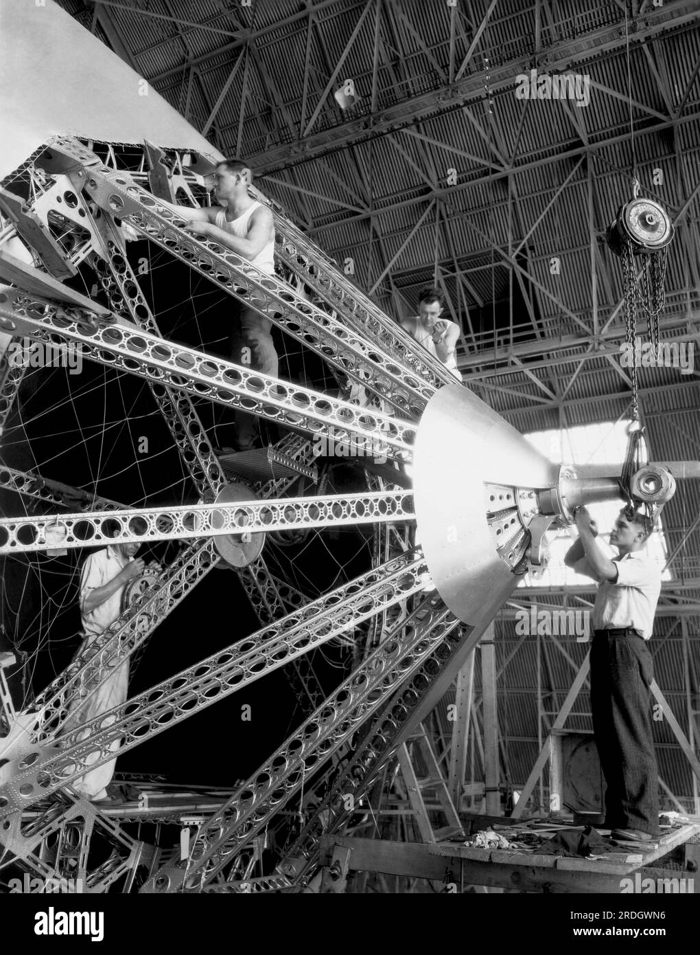 Akron, Ohio:  c. 1930 Workmen in the Goodyear Rubber Plant putting the finishing touches on the U.S. Navy Dirigible, 'Akron'. It was a helium filled airship, and crashed in a severe storm into the Atlantic Ocean on April 3, 1933. Stock Photo
