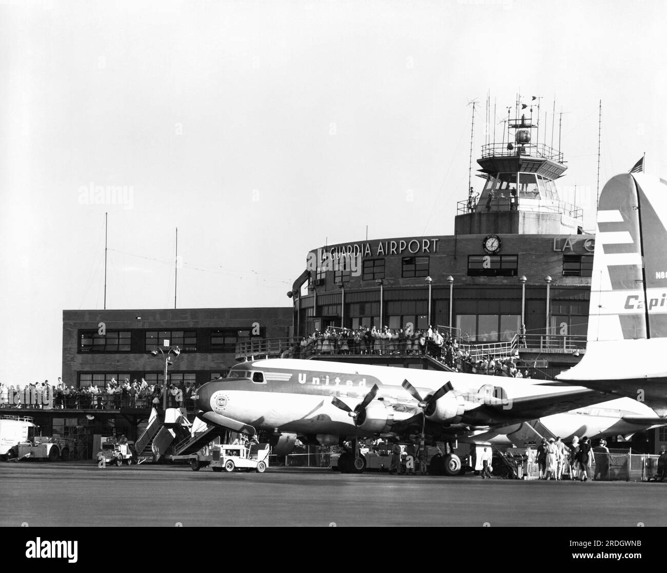 New York, New York:   August 23, 1955 The United Airlines DC-6 'Mainliner Ohio' passenger plane on the tarmac at LaGuardia Airport in Queens. Stock Photo