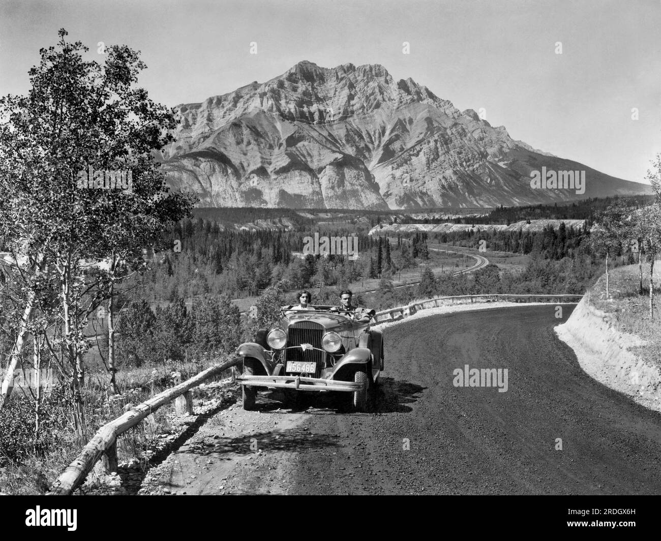 Alberta, Canada:   1931 Driving a 1930 Chrysler 77 Roadster along the Canadian Pacific Railway Line between Banff and Jasper in Canada. Stock Photo