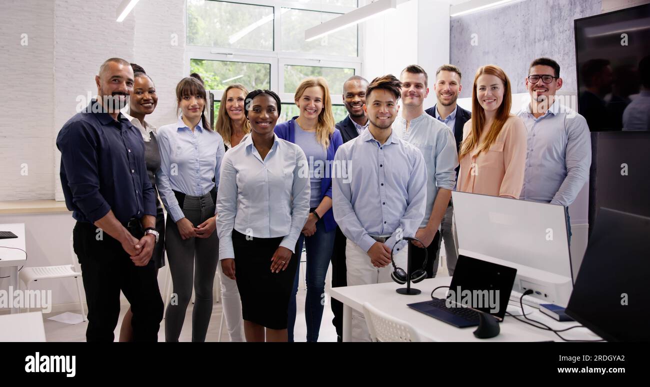 Happy Group Of Business People Standing In Office Stock Photo - Alamy