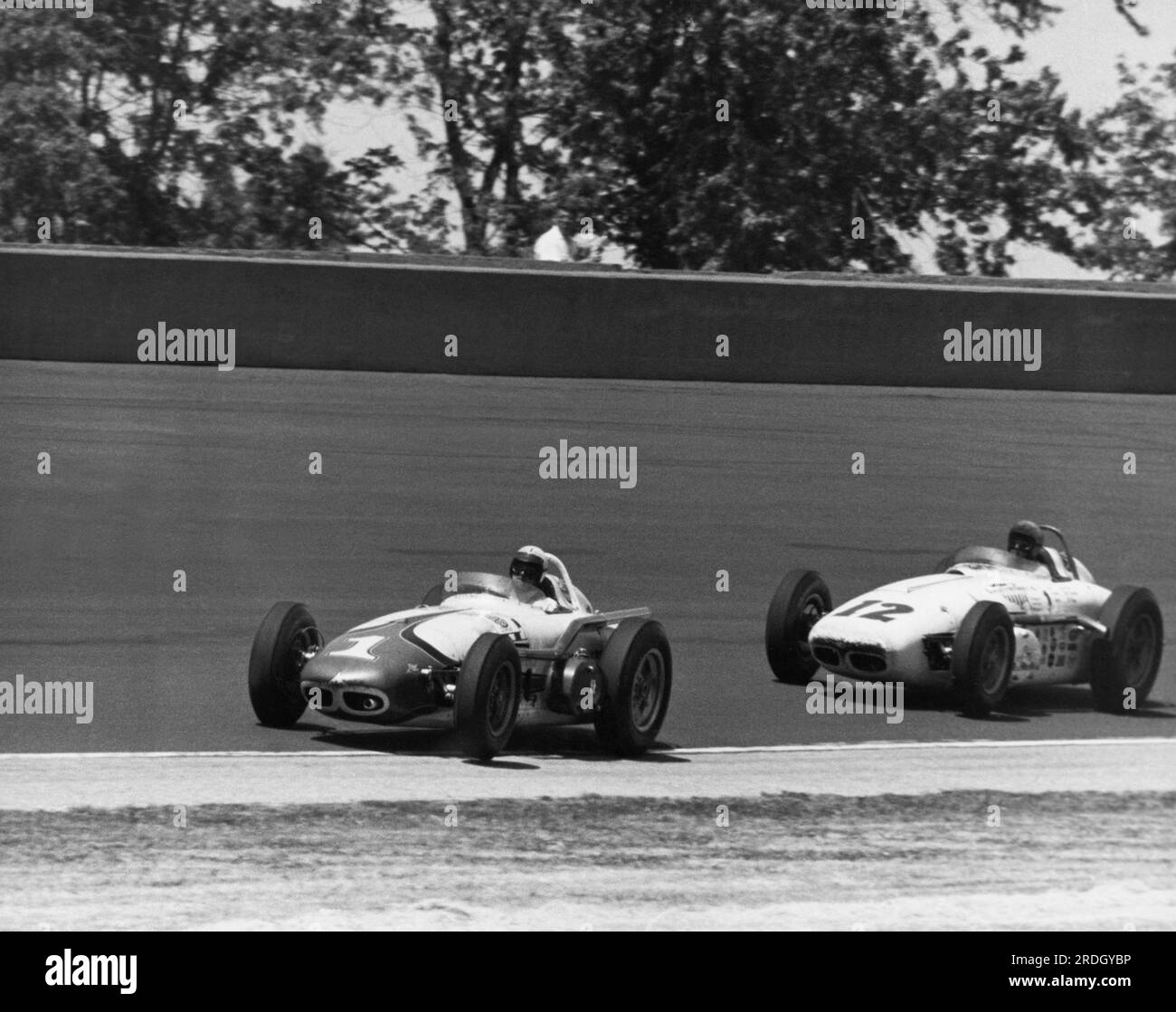 Indianapolis, Indiana:  May, 1961 Race car driver A.J. Foyt leading Eddie Sachs through turn #1 at the Indianapolis Speedway 500 race track. Stock Photo