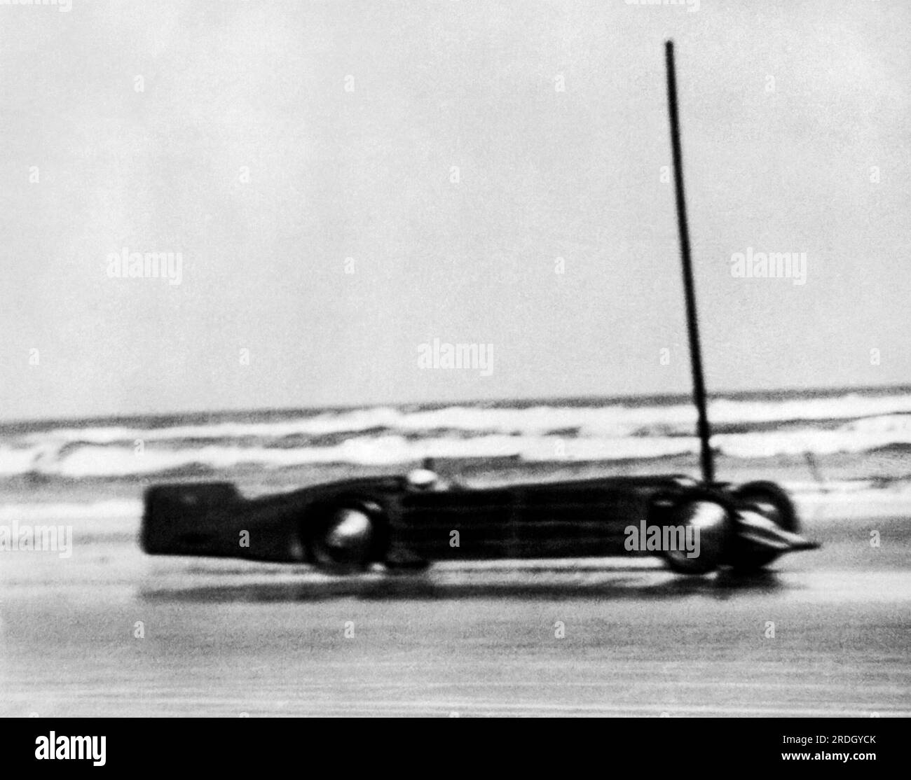 Daytona Beach, Florida:  March 11, 1929 British Major Henry Seagrave in his Golden Arrow race car setting the world record speed of 231.36 mph at Daytona Beach. Stock Photo