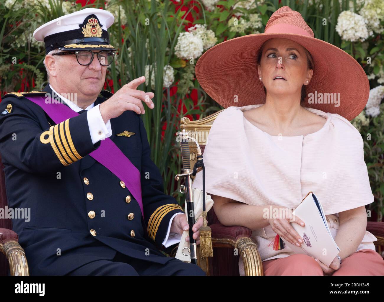 Belgian Prince Laurent (L) is pictured with Princess Claire (R) and her  daughter Princess Louise on the podium during the military parade on the  occasion of Belgium?s National Day in Brussels, Belgium