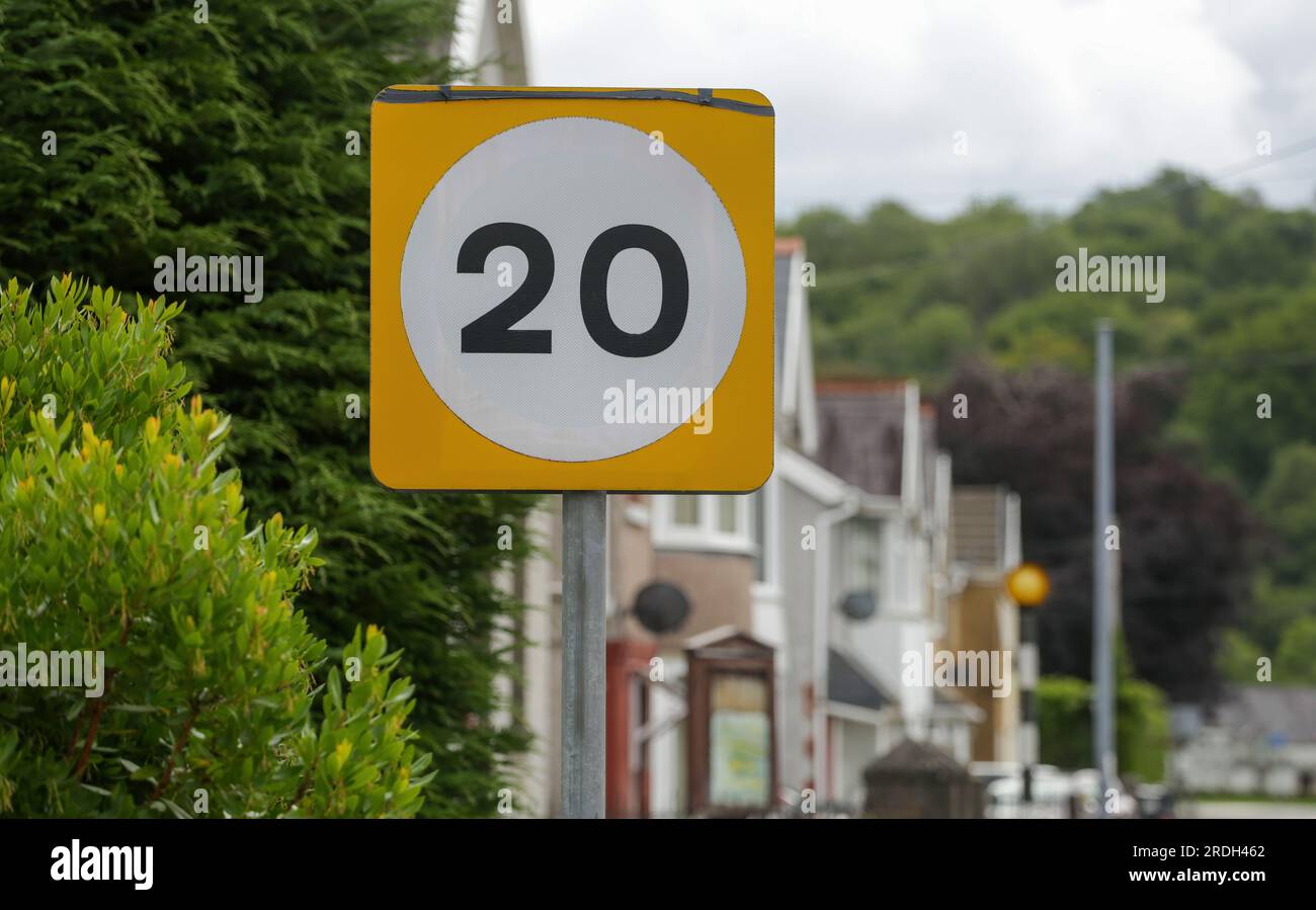 A 20 UK miles per hour road sign, a soon to be introduced speed reduction from 30 mph on roads in the UK where people live, work or play. Stock Photo