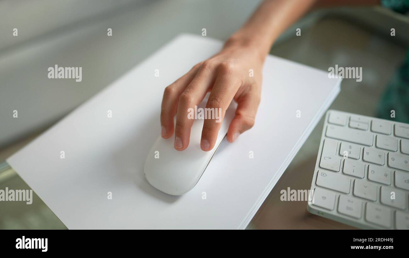 Young boy using mouse browsing internet online Stock Photo - Alamy