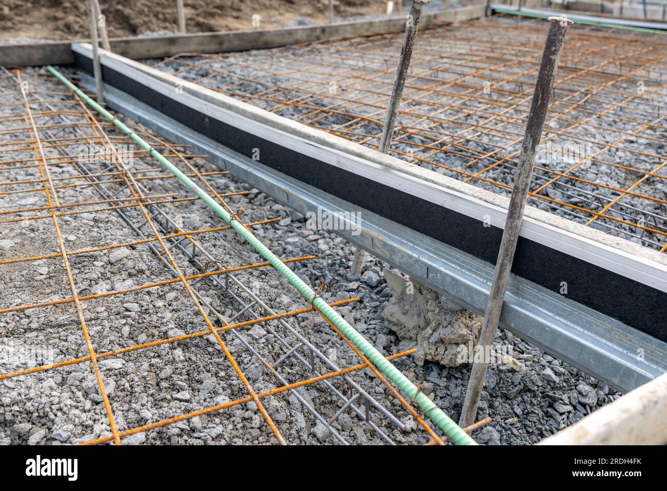 Welded wire mesh, WWM, installed within a sidewalk concrete form prior