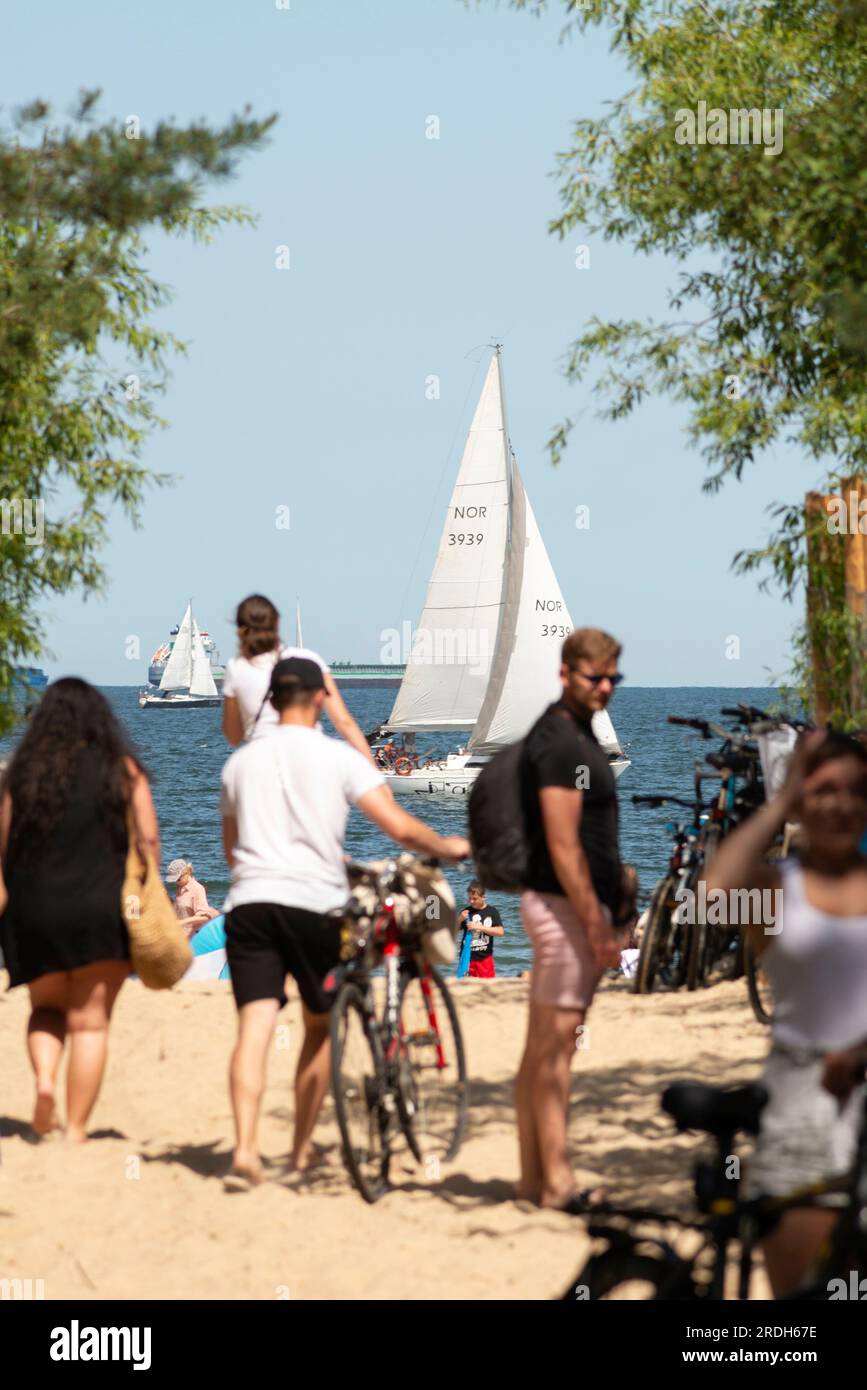 Beachgoers at one of the many entrances to Brzezno Beach, Gdansk, Baltic Sea, Poland Stock Photo