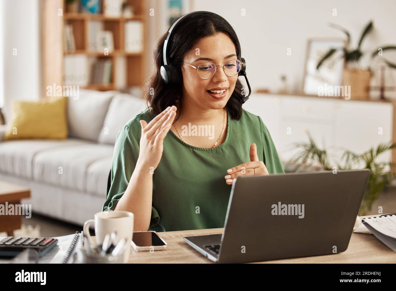 Home customer support, laptop video call and woman explain consultation, ecommerce or sales pitch in webinar. Freelance, remote work receptionist or Stock Photo