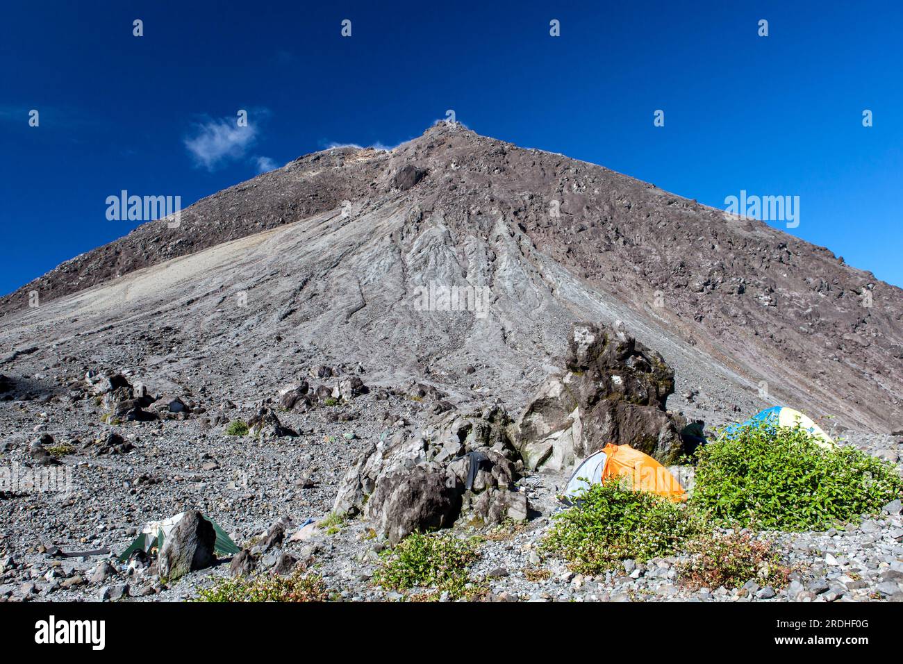 Camping in front of Merapi volcano lava dome. Tents on the slope of ...