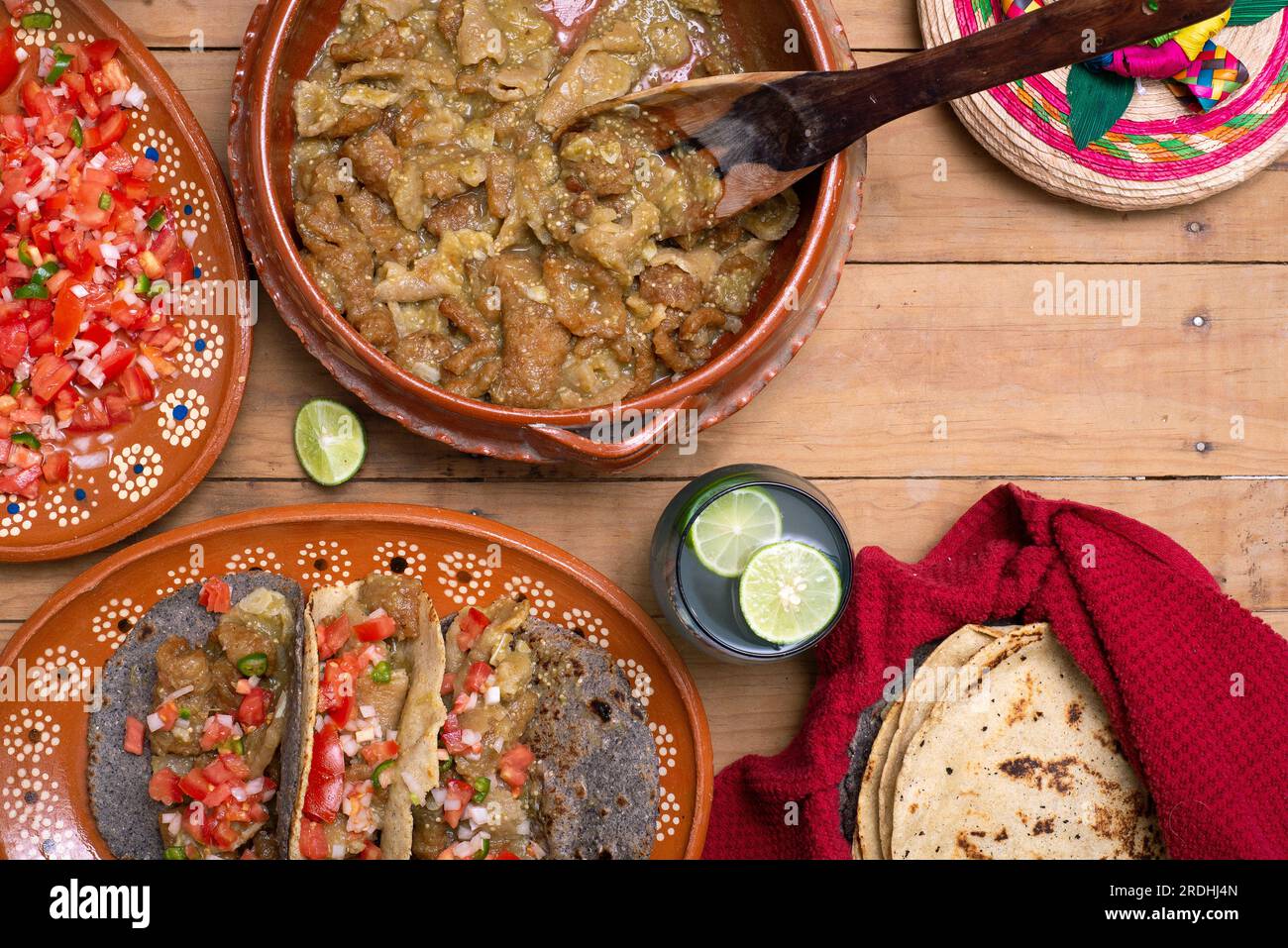Chicharrones in a green sauce tacos served with pico de gallo salad
