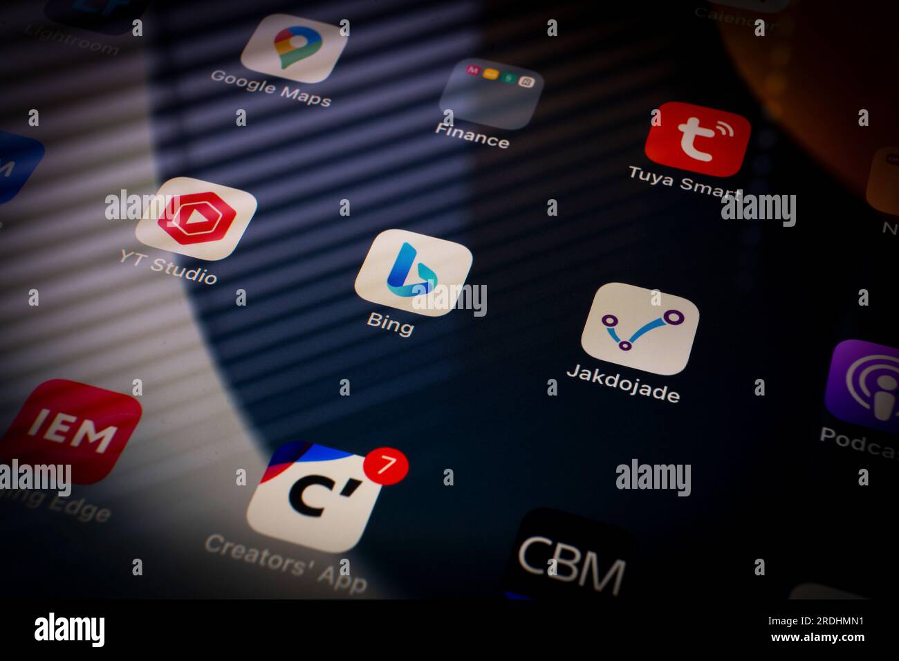 Apps are seen on an iPad home screen. Stock Photo