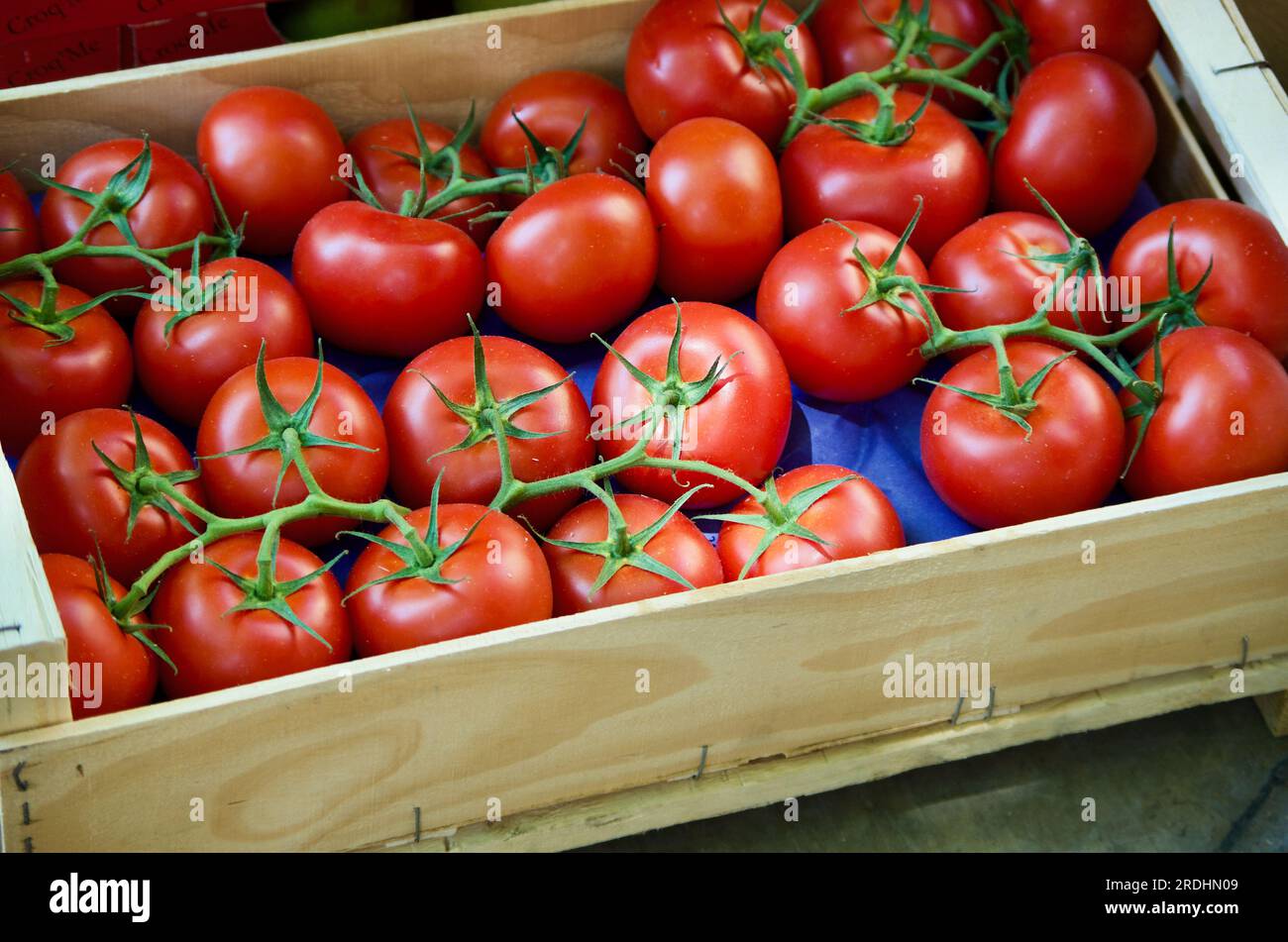 Tomatoes in wooden box for sale at farmers market in Provence in France Stock Photo Alamy