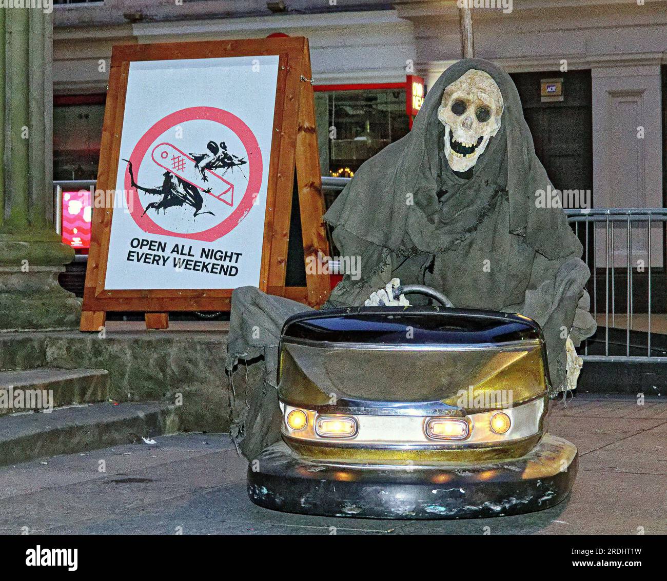 Glasgow, Scotland, UK 21st July, 2023.  the graveyard shift  on Fridays  and  Saturdays between 10pm and 5am at the new exhibition.Stubs can be renewed for a Banksy cocktail at max’s bar nearby. The grim reaper in a dodgem car gyrating to the tune of staying alive by the bee gees will appear rafter dark every night a radio controlled dummy that the organisers say is Banksy. Credit Gerard Ferry/Alamy Live News Stock Photo
