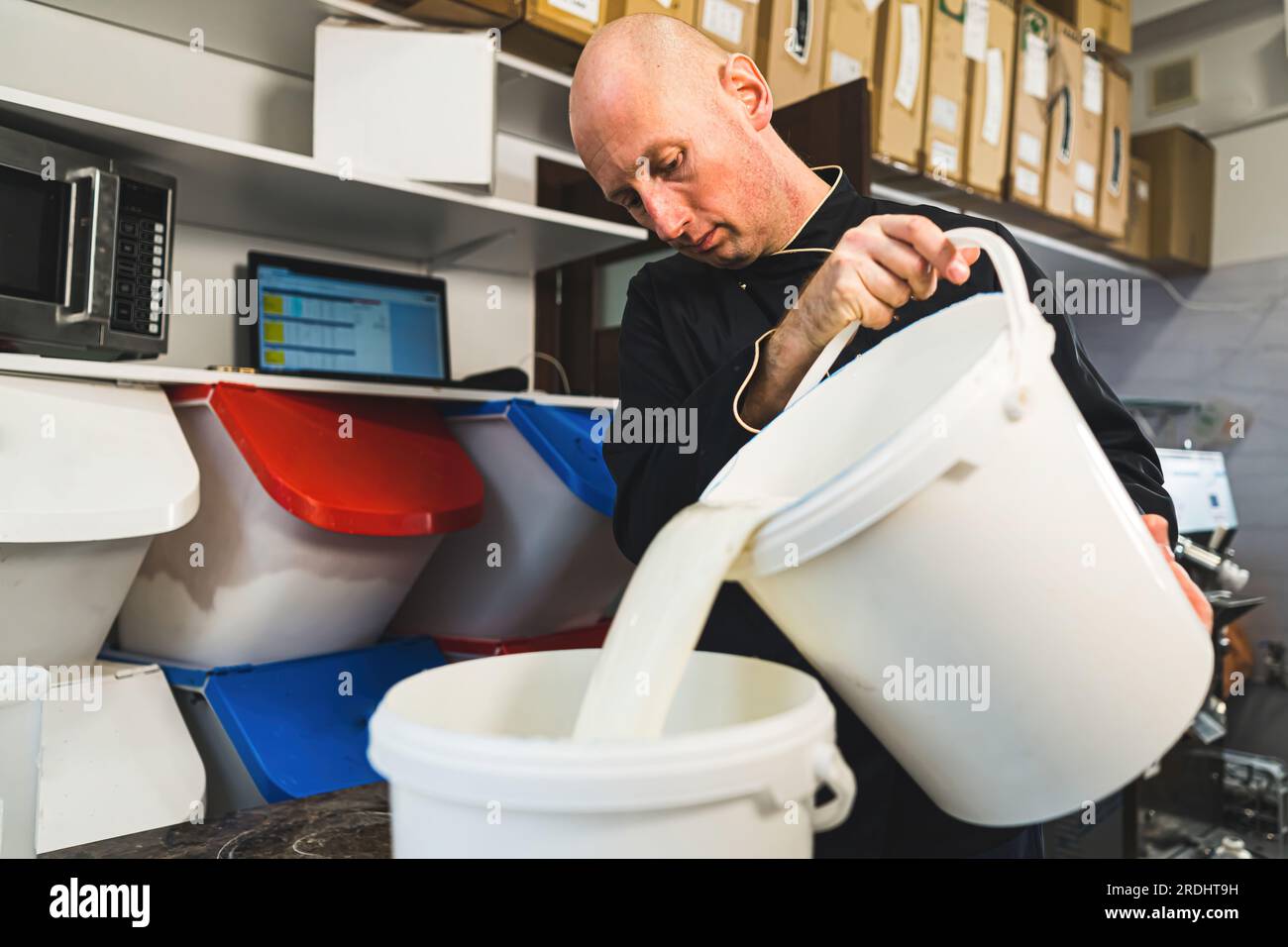 Production process of handmade ice cream. Skilled worker carefully