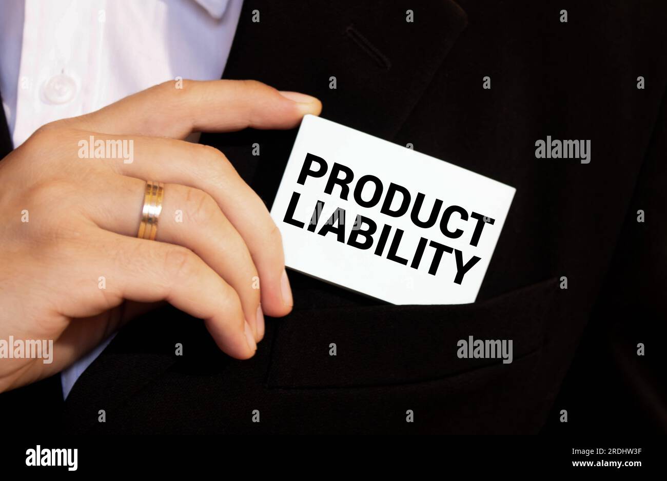 PRODUCT LIABILITY - words on a white sheet with leather notebooks, a judge's hammer and a pen Stock Photo