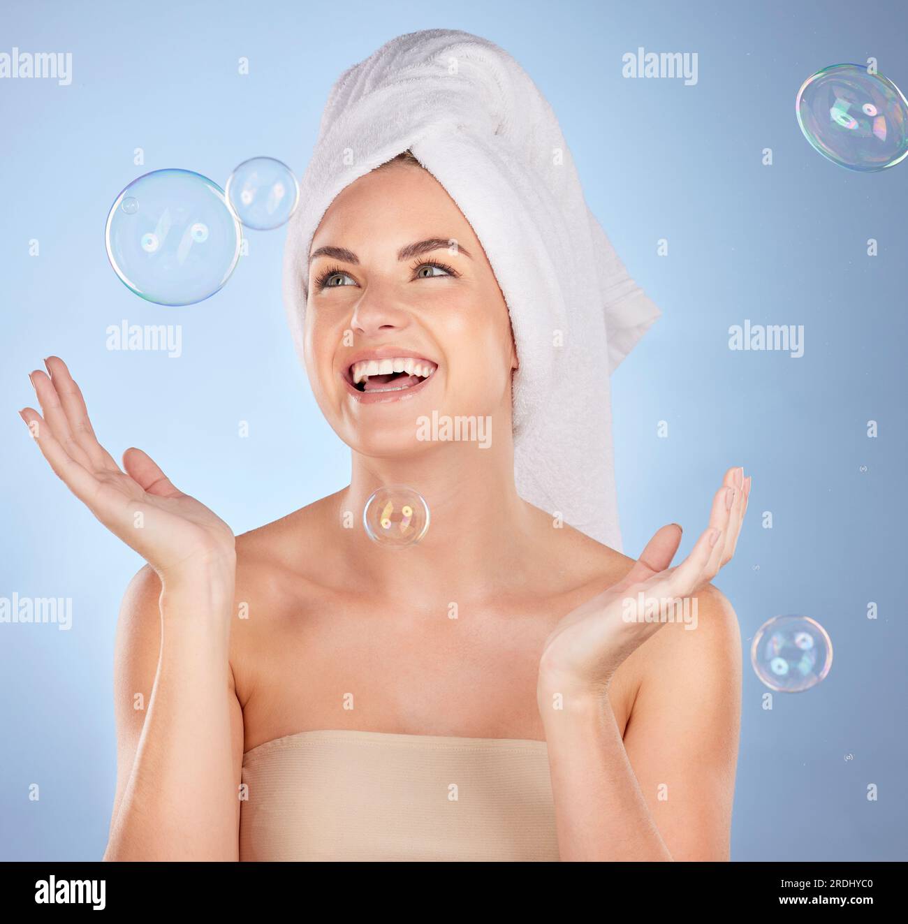 Happy, studio face and woman with bubbles for skincare, body cleaning