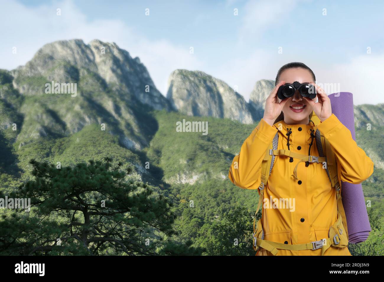 Tourist with backpack and binoculars in mountains Stock Photo Alamy