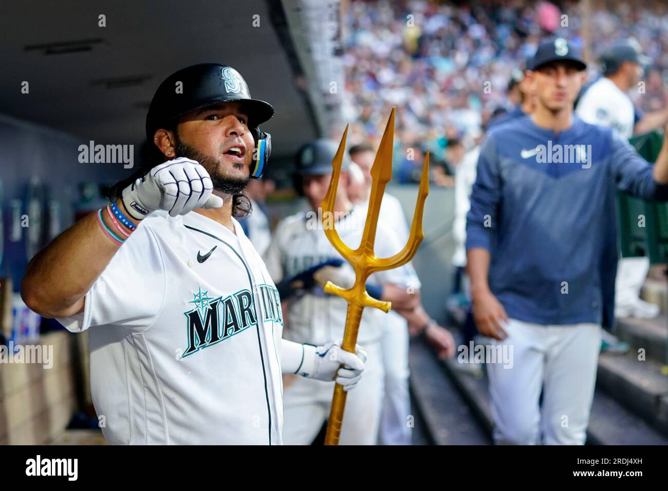 Seattle Mariners' Julio Rodriguez holds a trident in the dugout after  hitting a home run against the Oakland Athletics in a baseball game Monday,  Aug. 28, 2023, in Seattle. (AP Photo/Lindsey Wasson