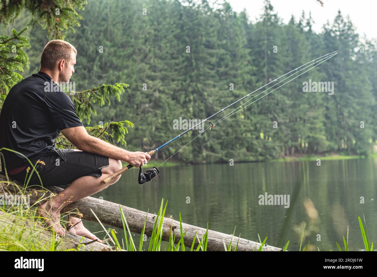 Man fishing rod reeling in hi-res stock photography and images - Page 3 -  Alamy